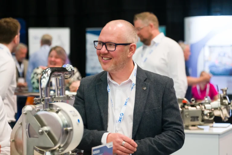Delegate beside a machinery demonstration at the 2026 Sustainable Food Factory and Food+Beverage Engineering event.