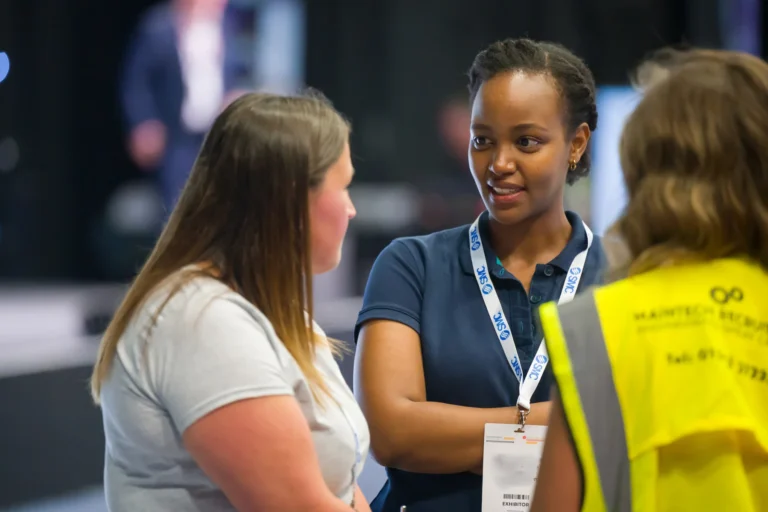 Delegates in conversation beside an exhibition stand at the 2026 Sustainable Food Factory and Food+Beverage Engineering event.