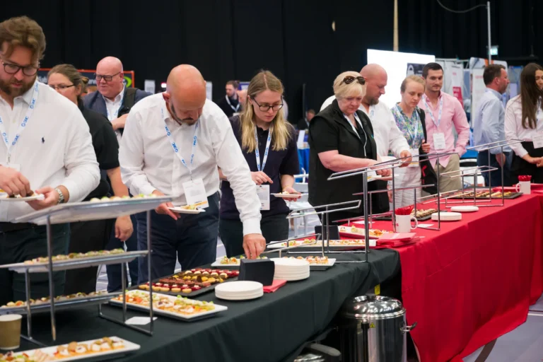 Delegates taking a break at the catering tables at the 2026 Sustainable Food Factory and Food+Beverage Engineering event.