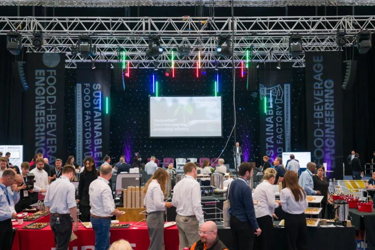Event overview showing visitors and the seminar stage at the 2026 Sustainable Food Factory and Food+Beverage Engineering event.