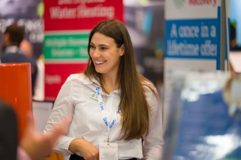 Exhibitor talking with visitors at a stand at the 2026 Sustainable Food Factory and Food+Beverage Engineering event.