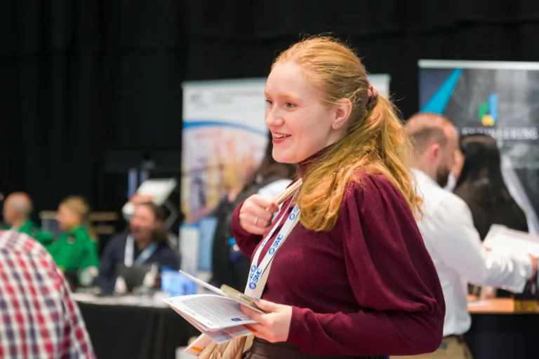 Visitor carrying event information at the 2026 Sustainable Food Factory and Food+Beverage Engineering event.