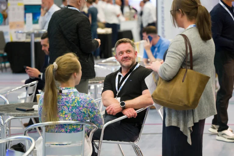 Visitors networking around cafe tables at the 2026 Sustainable Food Factory and Food+Beverage Engineering event.