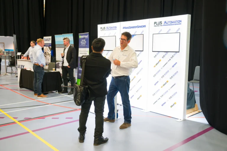 Visitors talking at an automation stand at the 2026 Sustainable Food Factory and Food+Beverage Engineering event.